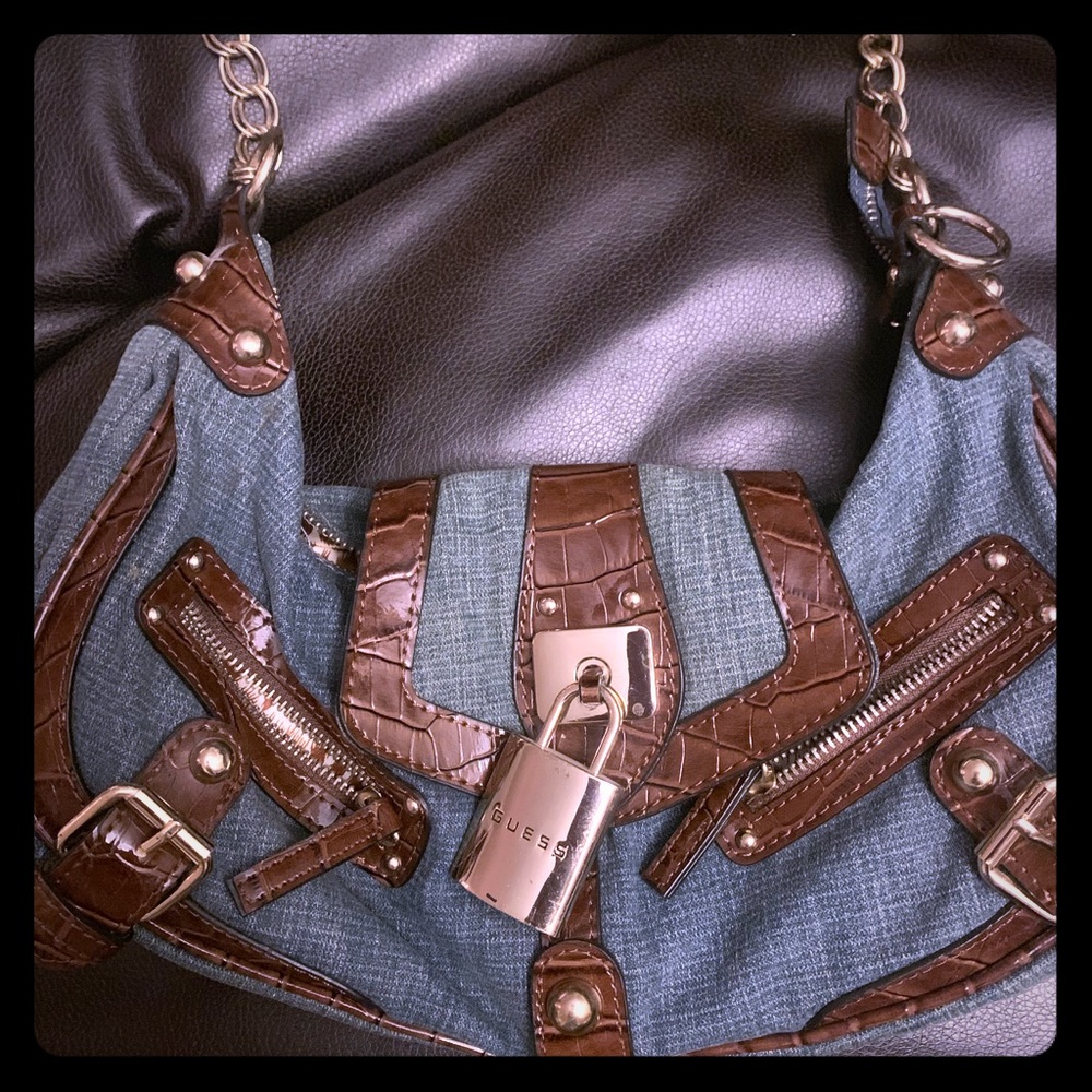 Cute purse with pad lock.